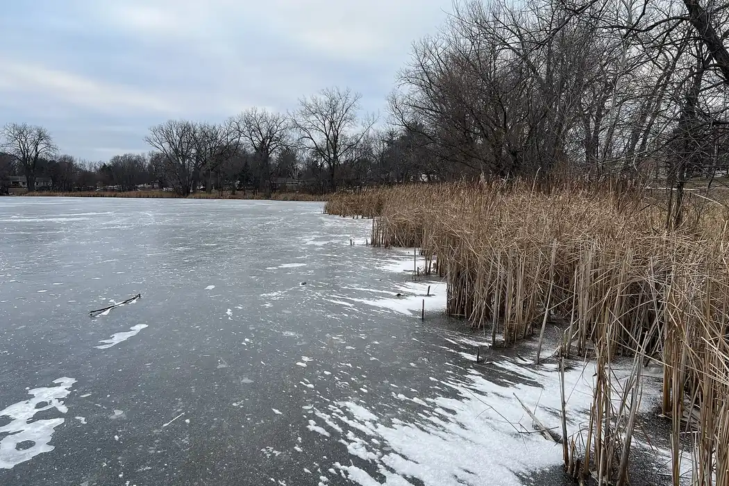 Frozen Wakefield Lake in Maplewood, Minnesota at the start of the new year 2025